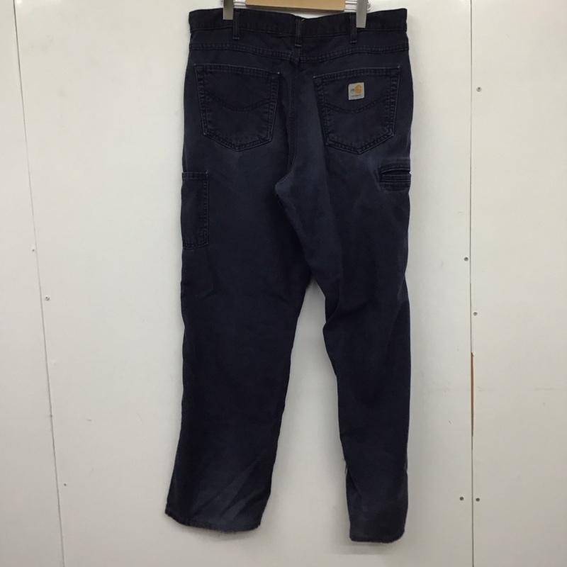 カーハート Carhartt パンツ ワークパンツ、ペインターパンツ ワークパンツ ワイドパンツ カジュアルパンツ 34インチ ロゴ、文字 紺 / ネイビー / メンズ USED 古着 中古 10137081