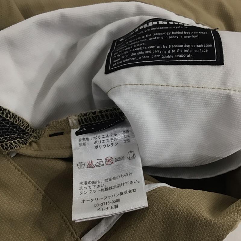 オークリー OAKLEY パンツ ワークパンツ、ペインターパンツ スリムパンツ ストレッチパンツ カジュアルパンツ 32インチ ロゴ、文字 ベージュ / ベージュ / メンズ USED 古着 中古 10140280