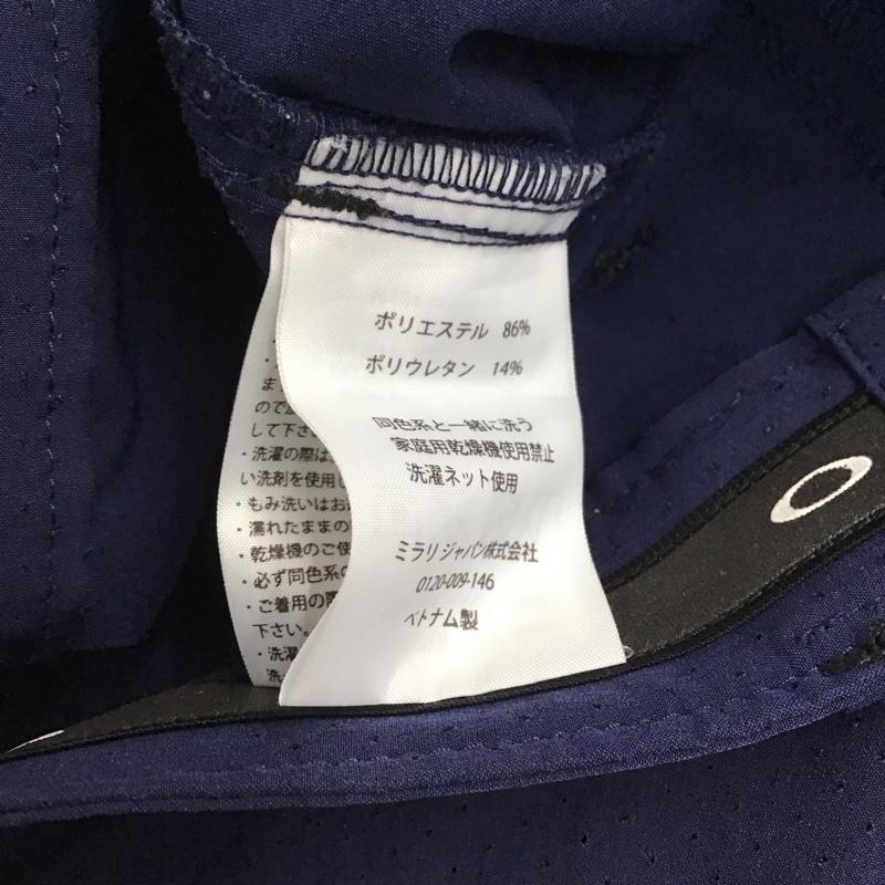 オークリー OAKLEY ボトムス ボトムス 422418JP ストレッチパンツ スポーツウェア ワンポイント 紺 / ネイビー / メンズ USED 古着 中古 10146364