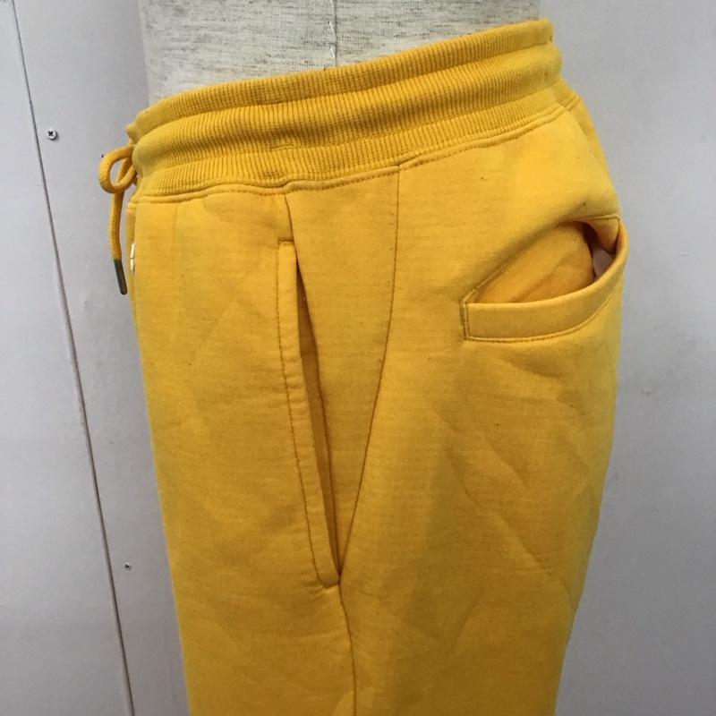 チャンピオン Champion ボトムス ボトムス C8-P205 Champion×X-LARGE REVERSEWEAVEPANT スウェットパンツ コラボ M ロゴ、文字 黄 / イエロー / メンズ USED 古着 中古 10110333