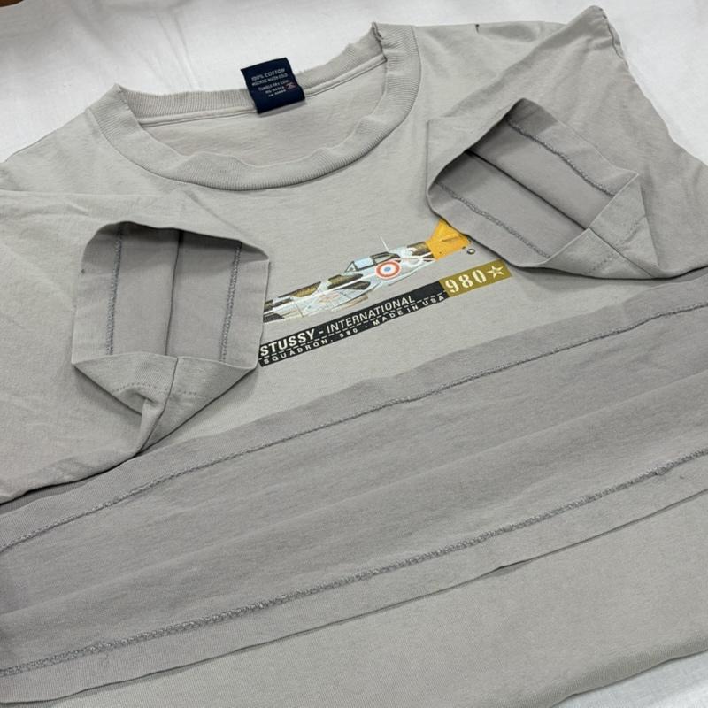ステューシー STUSSY Tシャツ 半袖 90s OLD オールド ロゴ 戦闘機 プリント 半袖 TシャツUSA製 ヴィンテージ 紺タグ シングルステッチ フェード L ロゴ、文字 X プリント 灰 / グレー / gray メンズ USED 古着 中古 50164451