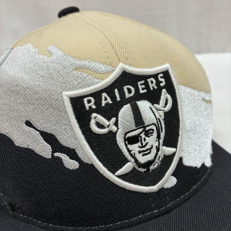 ミッチェルアンドネス Mitchell&Ness 帽子 キャップ RAIDERS NFL VINTAGE COLLECTION ペイント スプラッシュ スナップバック キャップ - メンズ USED 古着 中古 50166418