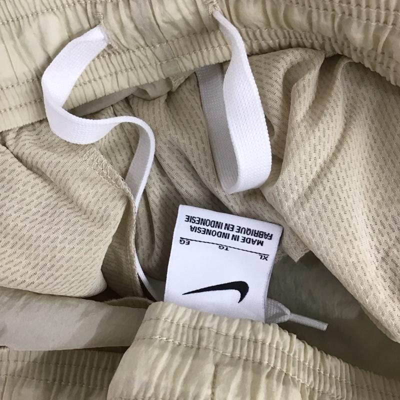 ナイキ NIKE パンツ ワークパンツ、ペインターパンツ dq5044-206 ウーブンパンツ ラタン サッカーフットサルウェアー ジャージ XL ロゴ、文字 オフホワイト / オフホワイト / メンズ USED 古着 中古 10112726