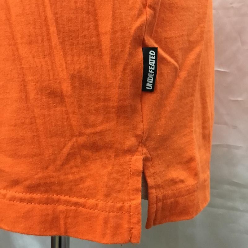 アンディフィーテッド UNDEFEATED Tシャツ 半袖 半袖カットソー プリントTシャツ クルーネックカットソー M プリント 橙 / オレンジ /  メンズ USED 古着 中古 10108964
