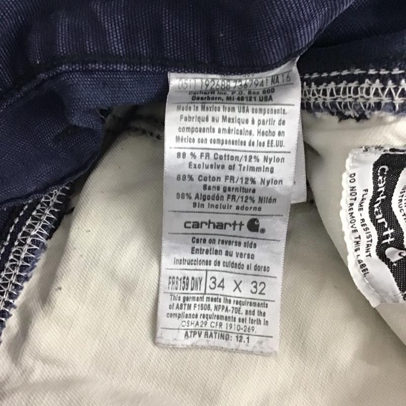カーハート Carhartt パンツ ワークパンツ、ペインターパンツ ワークパンツ ワイドパンツ カジュアルパンツ 34インチ ロゴ、文字 紺 / ネイビー / メンズ USED 古着 中古 10137081