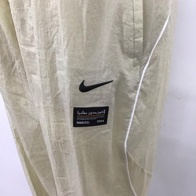 ナイキ NIKE パンツ ワークパンツ、ペインターパンツ dq5044-206 ウーブンパンツ ラタン サッカーフットサルウェアー ジャージ XL ロゴ、文字 オフホワイト / オフホワイト / メンズ USED 古着 中古 10112726
