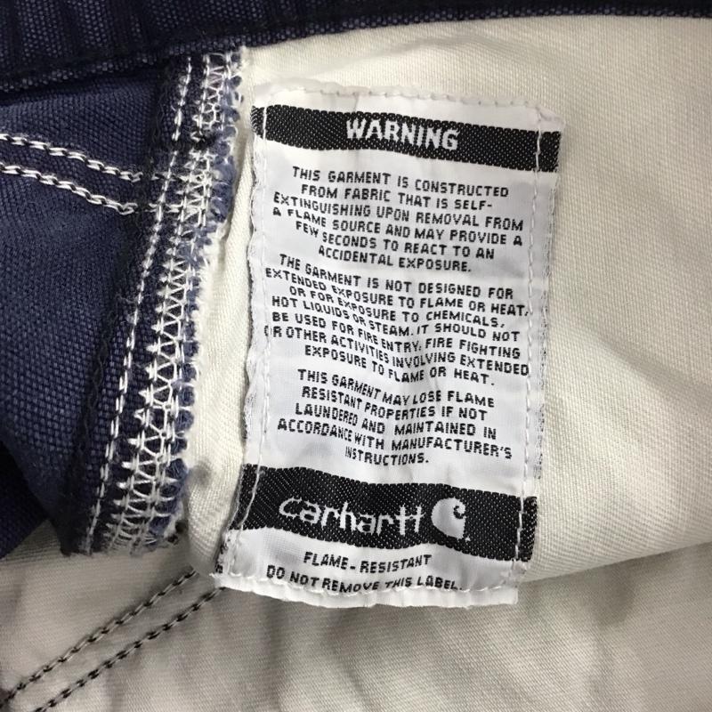 カーハート Carhartt パンツ ワークパンツ、ペインターパンツ ワークパンツ ワイドパンツ カジュアルパンツ 34インチ ロゴ、文字 紺 / ネイビー / メンズ USED 古着 中古 10137081