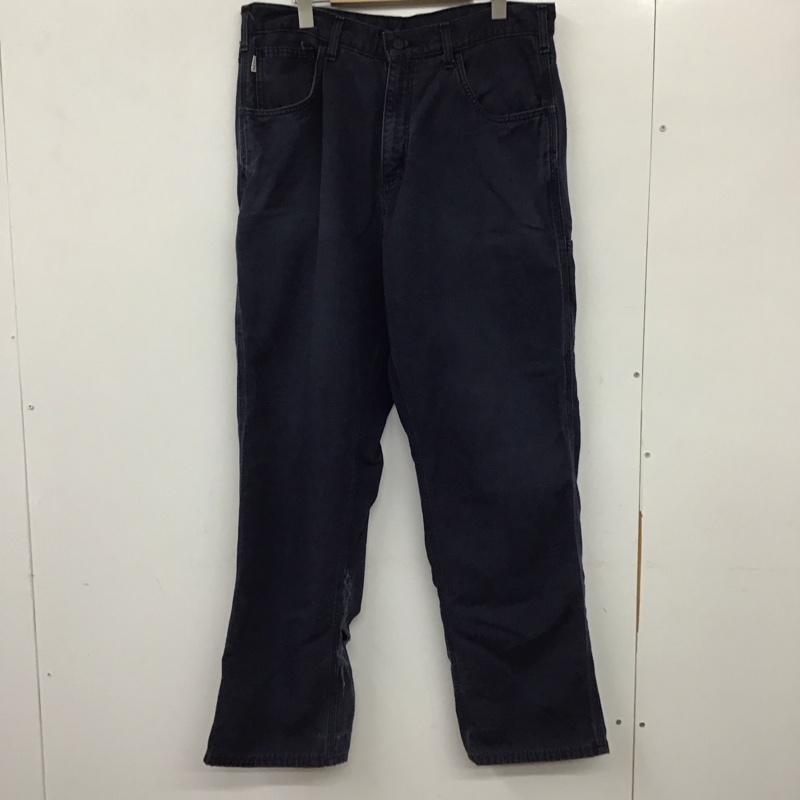 カーハート Carhartt パンツ ワークパンツ、ペインターパンツ ワークパンツ ワイドパンツ カジュアルパンツ 34インチ ロゴ、文字 紺 / ネイビー / メンズ USED 古着 中古 10137081