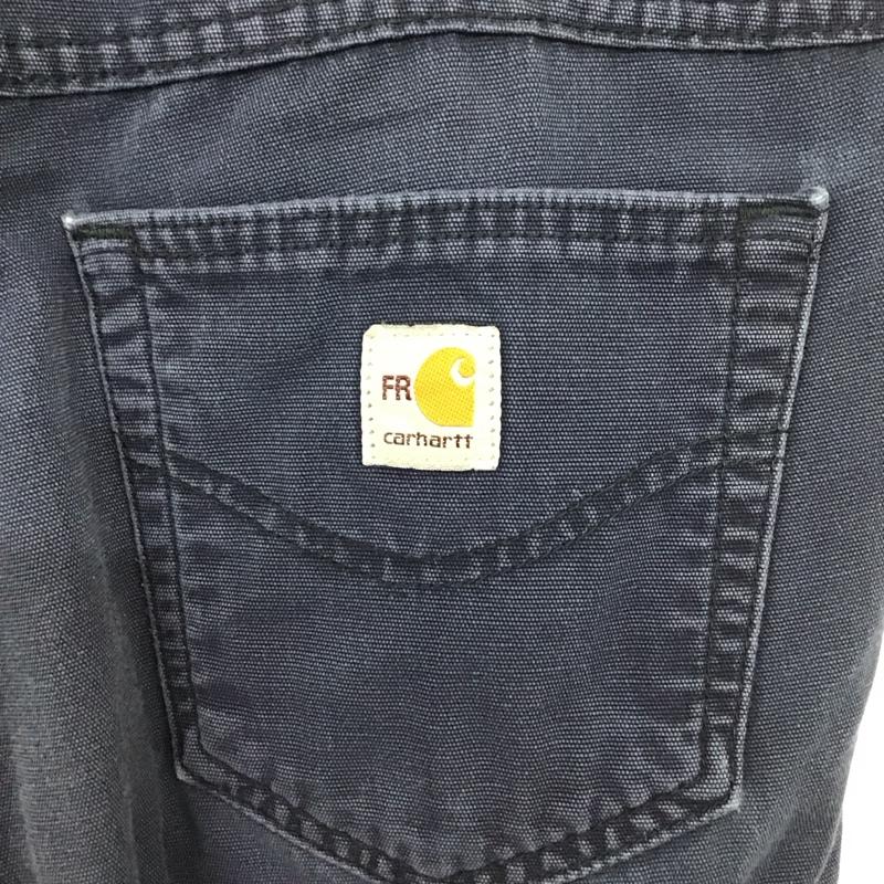 カーハート Carhartt パンツ ワークパンツ、ペインターパンツ ワークパンツ ワイドパンツ カジュアルパンツ 34インチ ロゴ、文字 紺 / ネイビー / メンズ USED 古着 中古 10137081