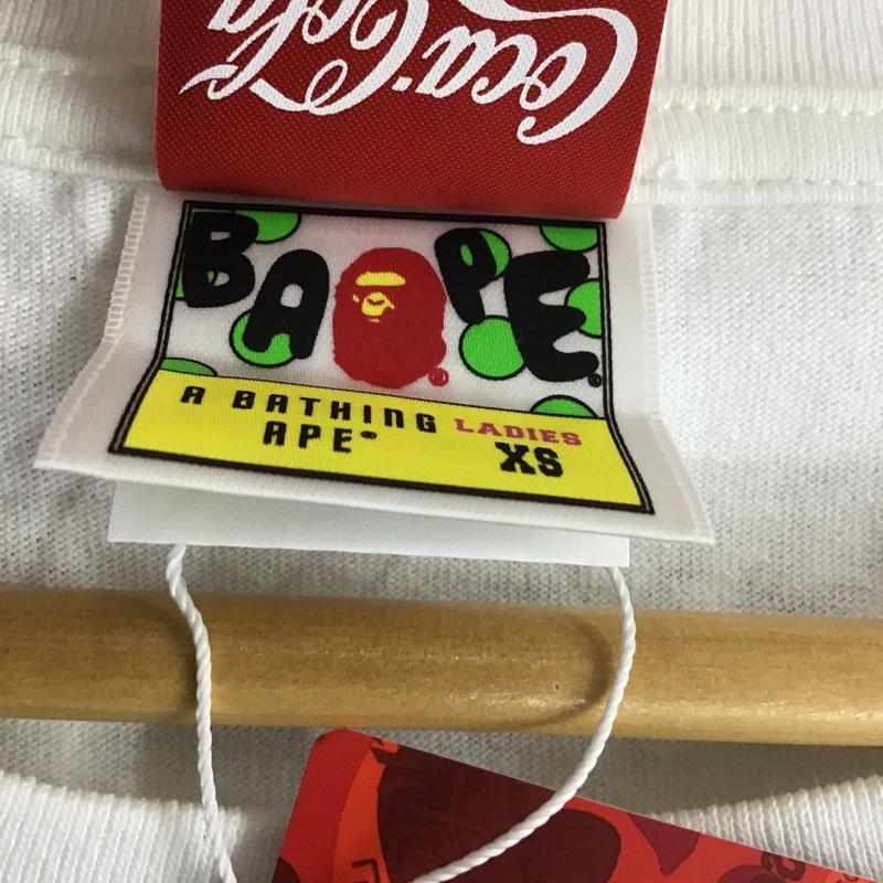 アベイシングエイプ A BATHING APE Tシャツ 半袖 コカ・コーラ タグ付 COCA-COLA XS ロゴ、文字 X プリント 白 / ホワイト / レディース USED 古着 中古 10081659