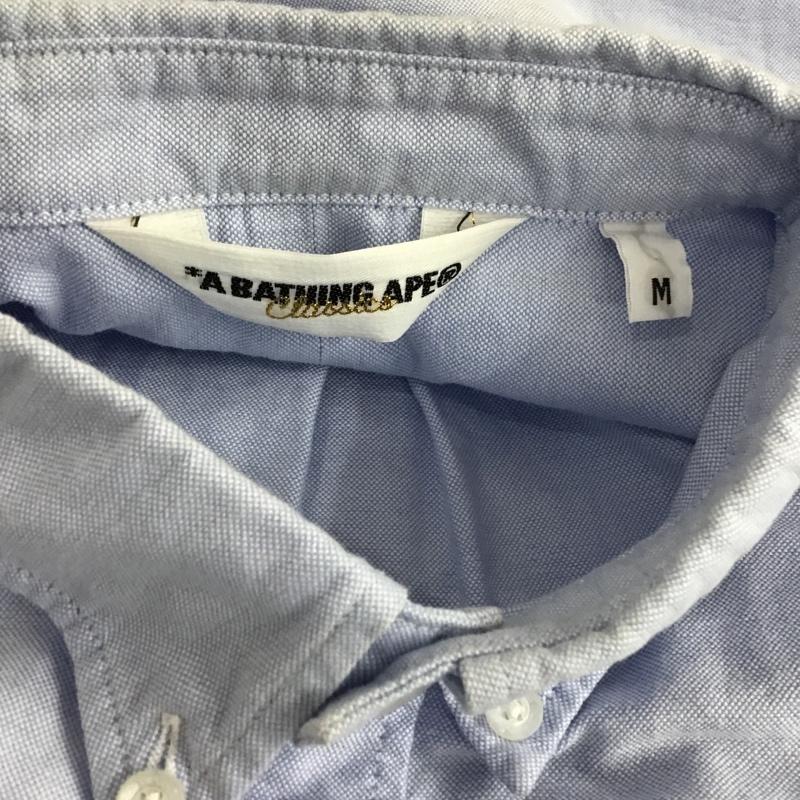 アベイシングエイプ A BATHING APE シャツ、ブラウス 半袖 半袖シャツ カラーシャツ 半袖カットソー ボタンダウンシャツ M ロゴ、文字 水色 / ライトブルー / メンズ USED 古着 中古 10103472