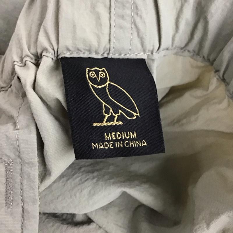 オクトーバーズ ベリー オウン OCTOBERS VERY OWN パンツ ショートパンツ ショートパンツ ハーフパンツ カジュアルパンツ ナイロンパンツ M ロゴ、文字 ベージュ / ベージュ /  メンズ USED 古着 中古 10137112