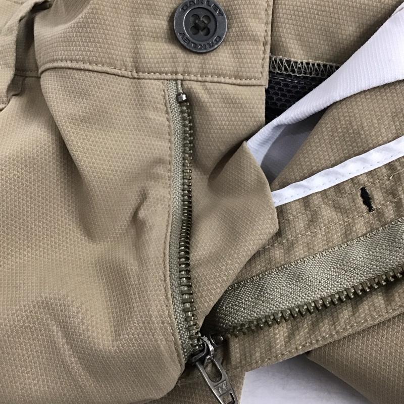オークリー OAKLEY パンツ ワークパンツ、ペインターパンツ スリムパンツ ストレッチパンツ カジュアルパンツ 32インチ ロゴ、文字 ベージュ / ベージュ /  メンズ USED 古着 中古 10140280