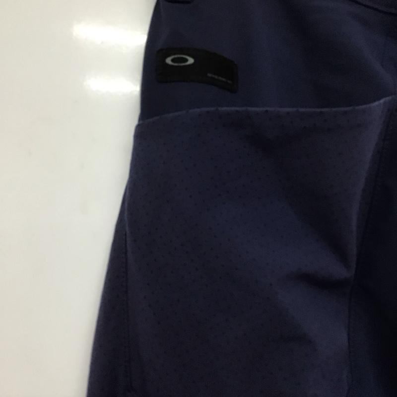 オークリー OAKLEY ボトムス ボトムス 422418JP ストレッチパンツ スポーツウェア ワンポイント 紺 / ネイビー /  メンズ USED 古着 中古 10146364