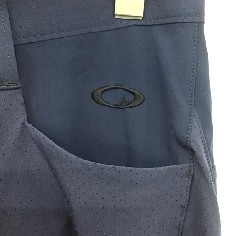 オークリー OAKLEY ボトムス ボトムス 422418JP ストレッチパンツ スポーツウェア ワンポイント 紺 / ネイビー /  メンズ USED 古着 中古 10146364