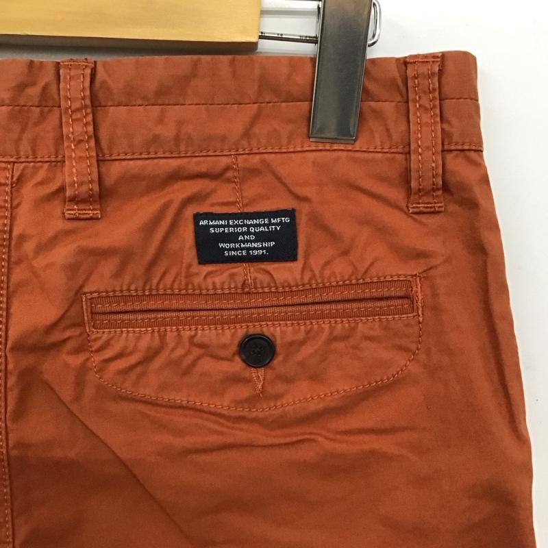 アルマーニエクスチェンジ ARMANI EXCHANGE パンツ ワークパンツ、ペインターパンツ カジュアルパンツ スリムパンツ ストレッチパンツ 31インチ 無地 橙 / オレンジ /  メンズ USED 古着 中古 10147082