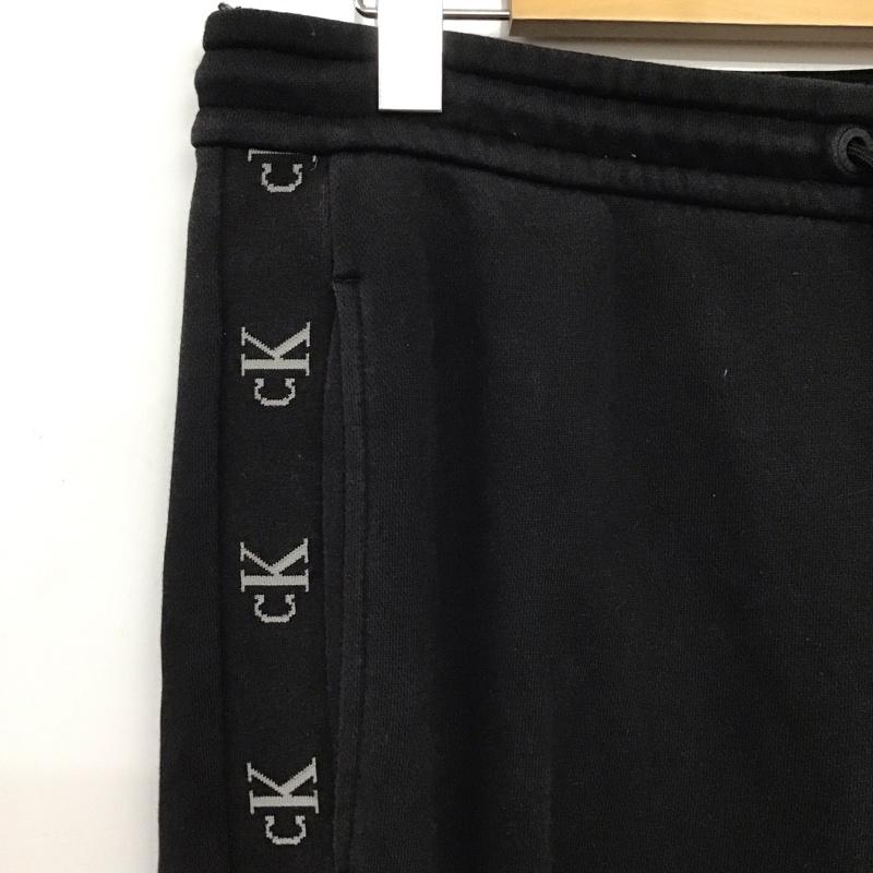 カルバン・クライン Calvin Klein パンツ ワークパンツ、ペインターパンツ スウェットパンツ ワイドパンツ カジュアルパンツ M ロゴ、文字 ダークグレー / ダークグレー / メンズ USED 古着 中古 10157593