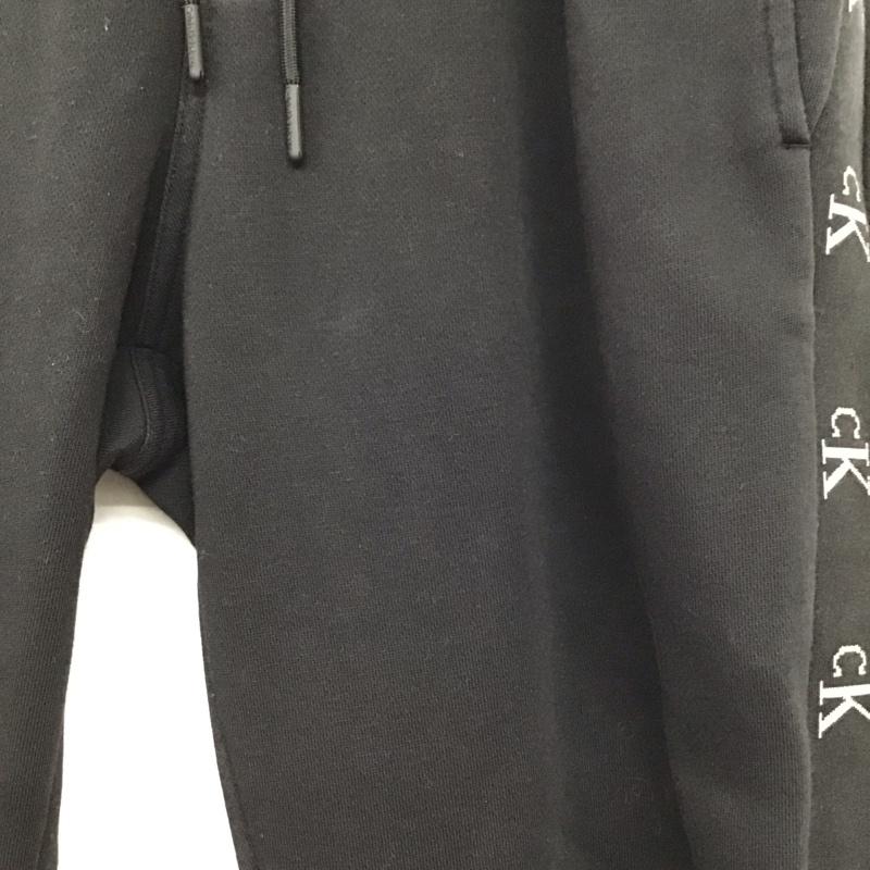 カルバン・クライン Calvin Klein パンツ ワークパンツ、ペインターパンツ スウェットパンツ ワイドパンツ カジュアルパンツ M ロゴ、文字 ダークグレー / ダークグレー / メンズ USED 古着 中古 10157593