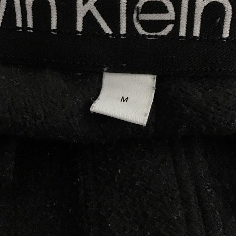 カルバン・クライン Calvin Klein パンツ ワークパンツ、ペインターパンツ スウェットパンツ ワイドパンツ カジュアルパンツ M ロゴ、文字 ダークグレー / ダークグレー / メンズ USED 古着 中古 10157593