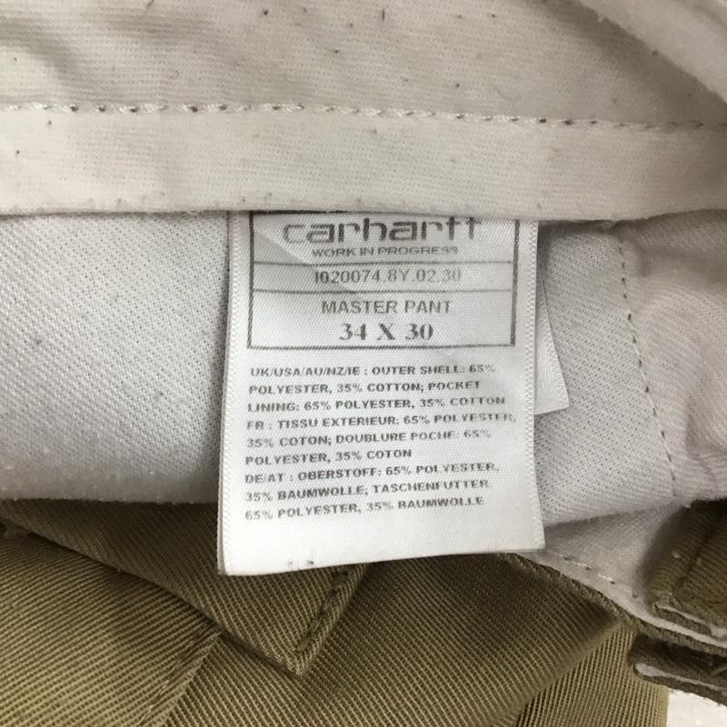 カーハート Carhartt パンツ ワークパンツ、ペインターパンツ ワークパンツ ワイドパンツ カジュアルパンツ 34 ロゴ、文字 ベージュ / ベージュ / beige メンズ USED 古着 中古 10157666