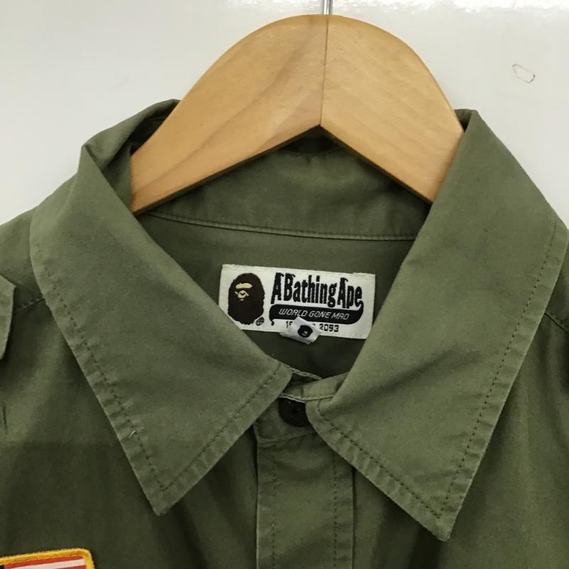 アベイシングエイプ A BATHING APE シャツ、ブラウス 半袖 半袖シャツ プリントシャツ ポケットシャツ M ロゴ、文字 カーキ / カーキ / khaki メンズ USED 古着 中古 10160506