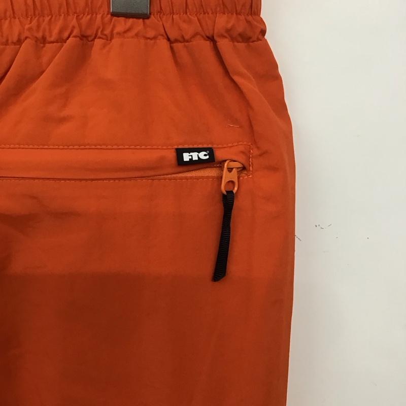 エフティーシー FTC パンツ ワークパンツ、ペインターパンツ ワークパンツ ナイロンパンツ ワイドパンツ 裾ジップ L 無地 橙 / オレンジ /  メンズ USED 古着 中古 10137367