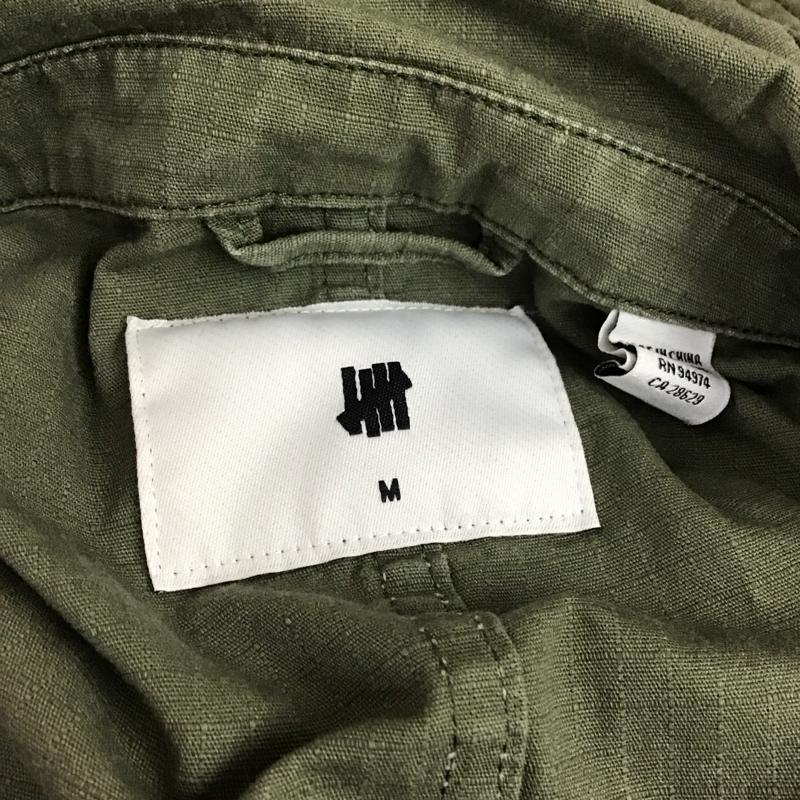 アンディフィーテッド UNDEFEATED ジャケット、上着 ジャケット、ブレザー 172076104007 ミリタリー シャツジャケット M ロゴ、文字 カーキ / カーキ /  メンズ USED 古着 中古 10114742