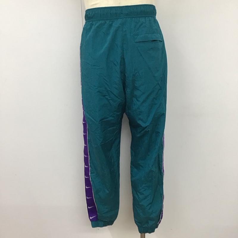 ナイキ NIKE パンツ ワークパンツ、ペインターパンツ cv9180-381 ワイドパンツ ジャージ ナイロンパンツ M ロゴ、文字 青 / ブルー /  メンズ USED 古着 中古 10119962