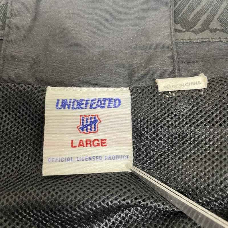 アンディフィーテッド UNDEFEATED ジャケット、上着 ジャンパー、ブルゾン 長袖 フルジップアップ ブルゾン ナイロンジャケット ロゴ 刺繍入り L ロゴ、文字 X 刺繍 黒 / ブラック / black メンズ USED 古着 中古 50149094