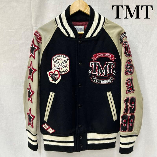 ティーエムティー TMT ジャケット、上着 ジャンパー、ブルゾン スタジャン スタジアムジャンパー ワッペン 袖レザー スター 1999 TJK-F10SP10 S ロゴ、文字 X 星 黒 / ブラック / black X ベージュ / ベージュ / beige X 赤 / レッド / red X 白 / ホワイト / white メンズ USED 古着 中古 50151366