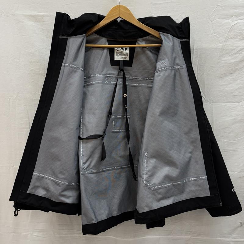 コムフィアウトドアガーメント COMFY OUTDOOR GARMENT ジャケット、上着 ジャンパー、ブルゾン GUIDE SHELL MOD COEXIST フード収納 ナイロン シェル ジャケット CMF2402-J11C L 黒 / ブラック / black メンズ USED 古着 中古 50155113