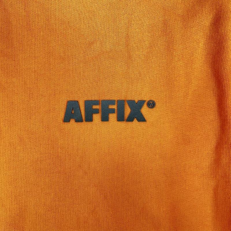 アフィックス AFFIX トレーナー 長袖 969784 new utility ワンポイント ロゴ 裏起毛 クルーネック L ロゴ、文字 橙 / オレンジ / orange メンズ USED 古着 中古 50160326