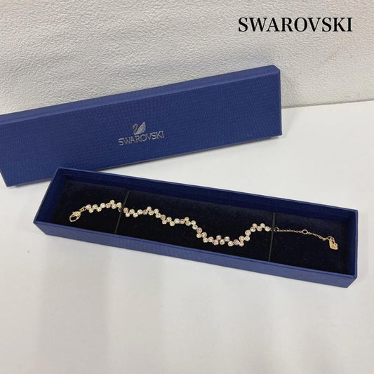 スワロフスキー SWAROVSKI アクセサリー ブレスレット、バングル クリア ピンク クリスタル スワロフスキー ブレスレット ウェーブ デザイン - 金 / ゴールド / gold color X 透明 / クリア / X 桃 / ピンク / pink レディース USED 古着 中古 50161106