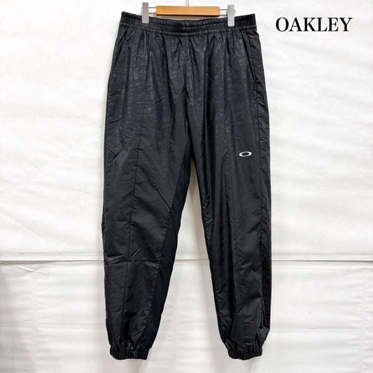 オークリー OAKLEY パンツ ワークパンツ、ペインターパンツ ナイロン ジョガー トラック パンツ ロゴ プリント XXL ワンポイント X ロゴ、文字 X プリント 黒 / ブラック / black X 白 / ホワイト / white メンズ USED 古着 中古 50161878