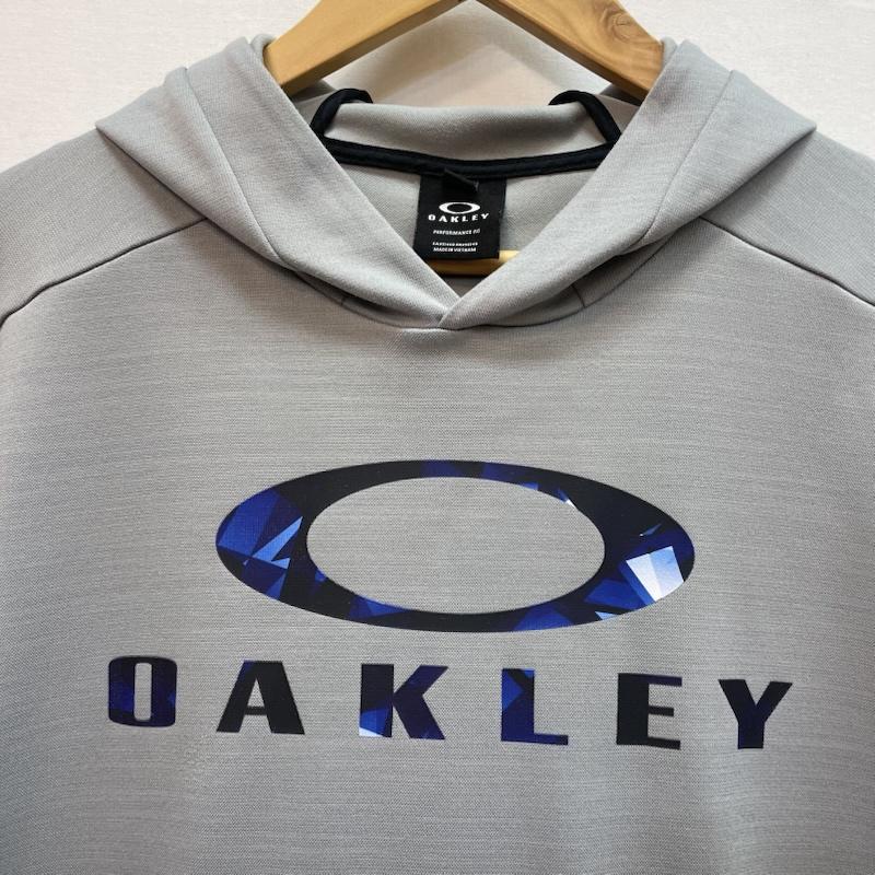 オークリー OAKLEY パーカー 半袖 幾何学模様 オークリー ロゴ プリント グレー プルオーバー 半袖 パーカー M 無地 X ロゴ、文字 X 幾何柄 灰 / グレー / gray X 青 / ブルー / blue メンズ USED 古着 中古 50162581