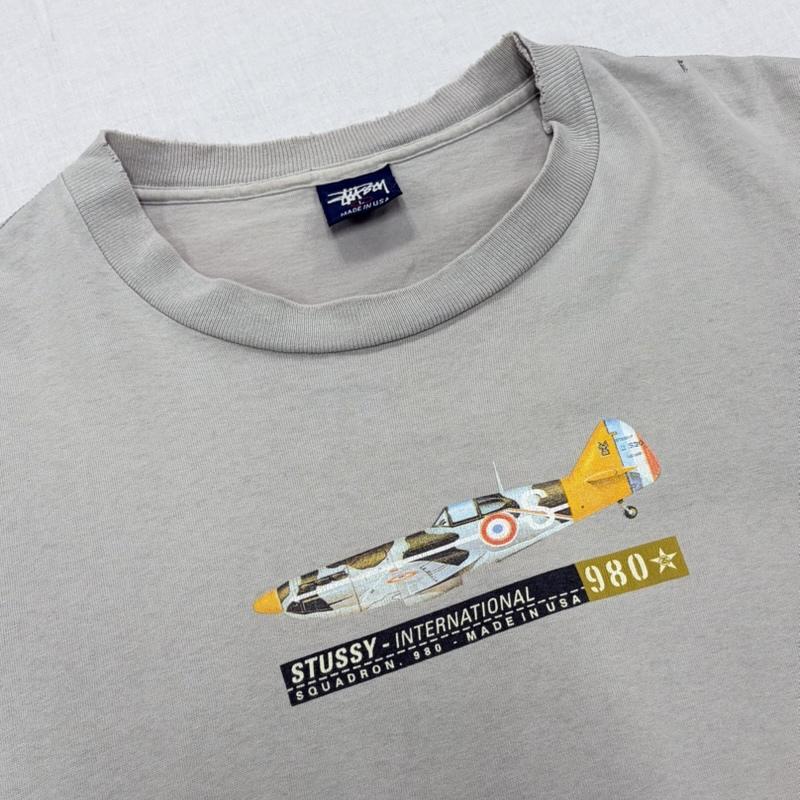 ステューシー STUSSY Tシャツ 半袖 90s OLD オールド ロゴ 戦闘機 プリント 半袖 TシャツUSA製 ヴィンテージ 紺タグ シングルステッチ フェード L ロゴ、文字 X プリント 灰 / グレー / gray メンズ USED 古着 中古 50164451