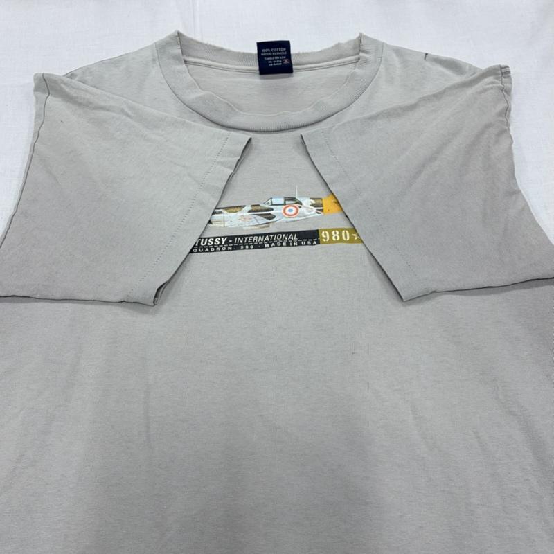 ステューシー STUSSY Tシャツ 半袖 90s OLD オールド ロゴ 戦闘機 プリント 半袖 TシャツUSA製 ヴィンテージ 紺タグ シングルステッチ フェード L ロゴ、文字 X プリント 灰 / グレー / gray メンズ USED 古着 中古 50164451
