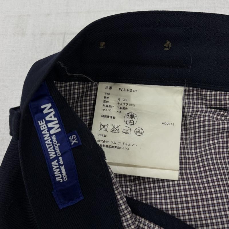 ジュンヤワタナベコムデギャルソンマン JUNYA WATANABE COMME des GARCONS MAN パンツ スラックス 12AW ウールツイルパンツ WJ-P041 ワーク スラックス ボタンフライ レザーパーツ XS 無地 紺 / ネイビー / navy メンズ USED 古着 中古 50170416