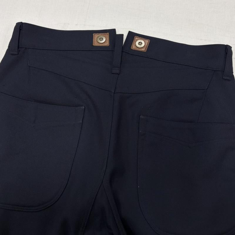 ジュンヤワタナベコムデギャルソンマン JUNYA WATANABE COMME des GARCONS MAN パンツ スラックス 12AW ウールツイルパンツ WJ-P041 ワーク スラックス ボタンフライ レザーパーツ XS 無地 紺 / ネイビー / navy メンズ USED 古着 中古 50170416