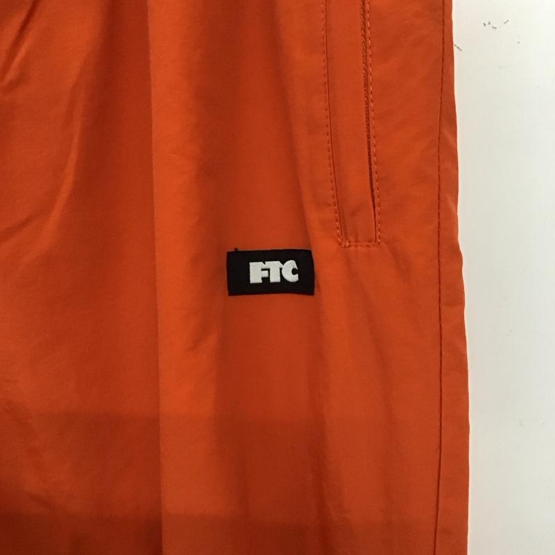 エフティーシー FTC パンツ ワークパンツ、ペインターパンツ ワークパンツ ナイロンパンツ ワイドパンツ 裾ジップ L 無地 橙 / オレンジ /  メンズ USED 古着 中古 10137367