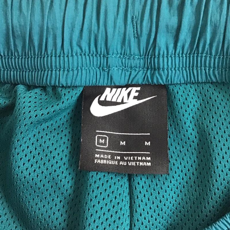 ナイキ NIKE パンツ ワークパンツ、ペインターパンツ cv9180-381 ワイドパンツ ジャージ ナイロンパンツ M ロゴ、文字 青 / ブルー /  メンズ USED 古着 中古 10119962