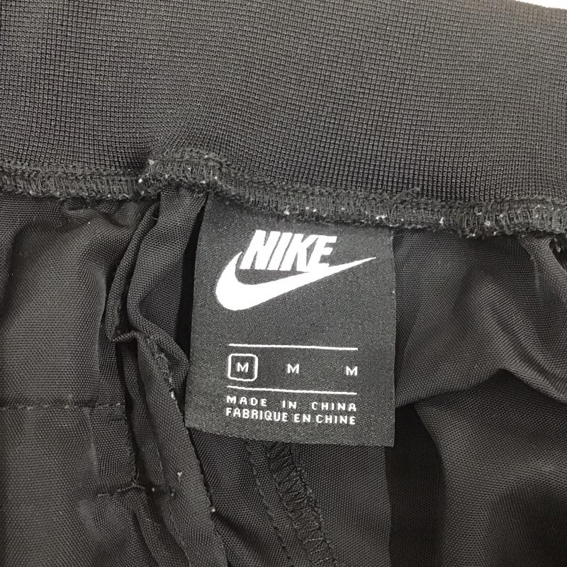 ナイキ NIKE ボトムス ボトムス DM1726-010 ウインドロングパンツ トラックパンツ M ロゴ、文字 黒 / ブラック /  レディース USED 古着 中古 10112416