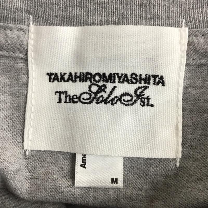 タカヒロ ミヤシタ ザ ソロイスト TAKAHIRO MIYASHITA The SoloIst. Tシャツ 半袖 横浜DNAベイスターズ M ロゴ、文字 X プリント 灰 / グレー /  メンズ USED 古着 中古 10111987