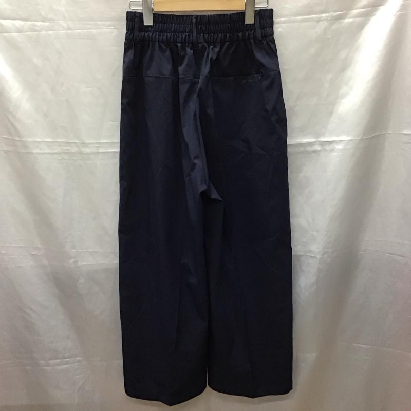 ニューバランス New Balance ボトムス ボトムス JWPL2201 THE CITY ワイドパンツ M ロゴ、文字 紺 / ネイビー /  レディース USED 古着 中古 10112464