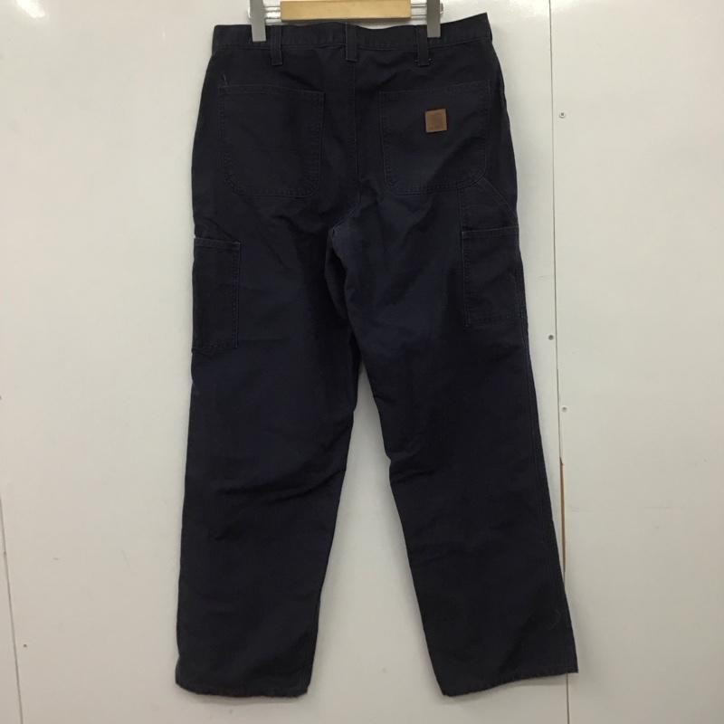 カーハート Carhartt パンツ ワークパンツ、ペインターパンツ ワイドパンツ カジュアルパンツ ワークパンツ 34インチ ロゴ、文字 紺 / ネイビー /  メンズ USED 古着 中古 10148529