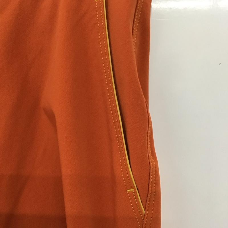 モンベル mont-bell パンツ ワークパンツ、ペインターパンツ 1105498 クリフパンツ スリムパンツ ストレッチパンツ L ロゴ、文字 橙 / オレンジ /  メンズ USED 古着 中古 10122004