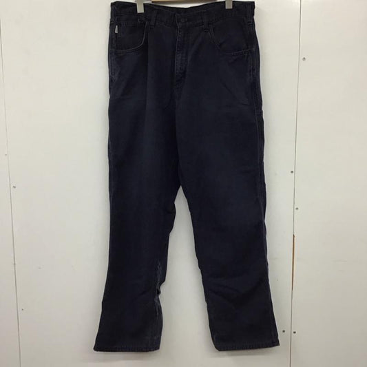 カーハート Carhartt パンツ ワークパンツ、ペインターパンツ ワークパンツ ワイドパンツ カジュアルパンツ 34インチ ロゴ、文字 紺 / ネイビー /  メンズ USED 古着 中古 10137081